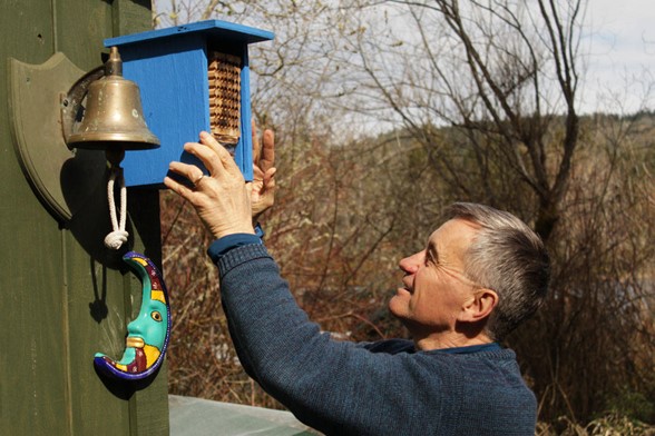 Saanich Mayor Fred Haynes proudly shows off his rented mason bee colony. (Devon Bidal/News Staff)